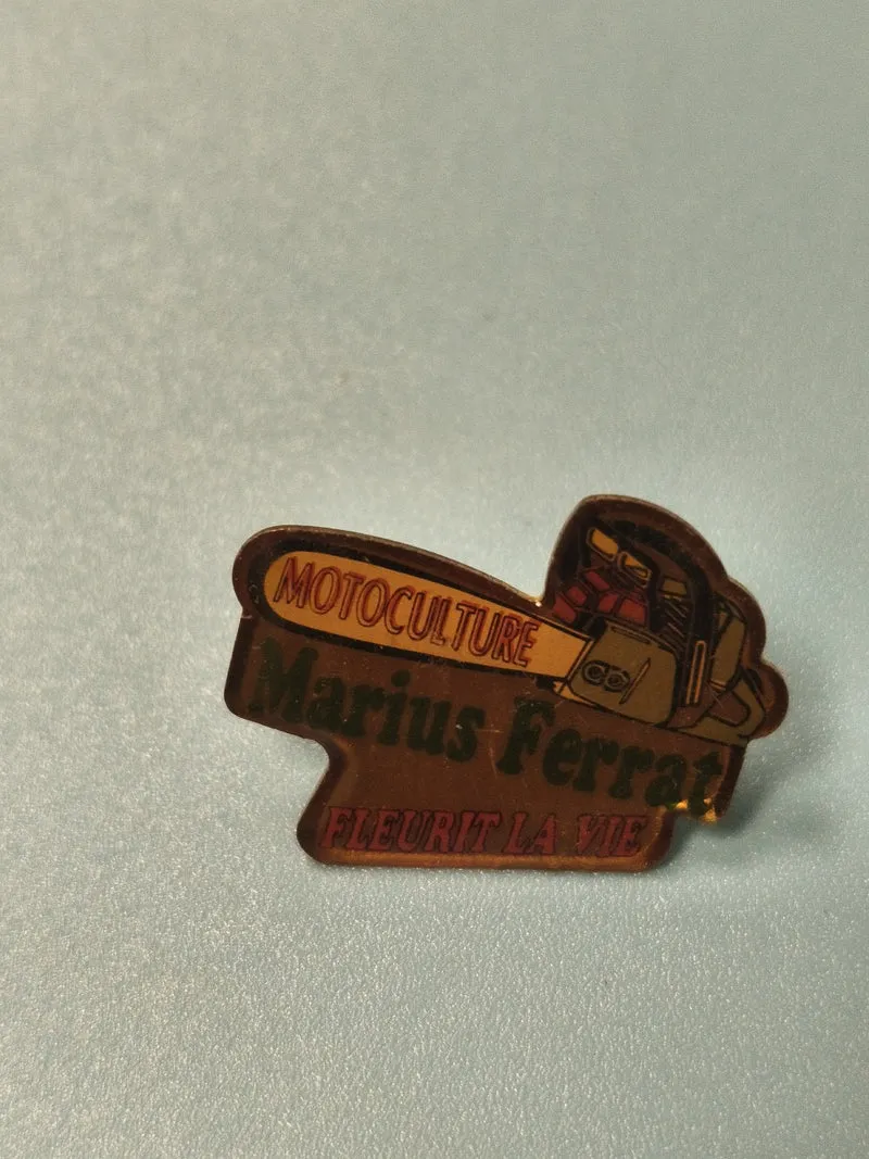 Vintage pin's Marius Ferrat motoculture publicitaire ancien, tronçonneuse