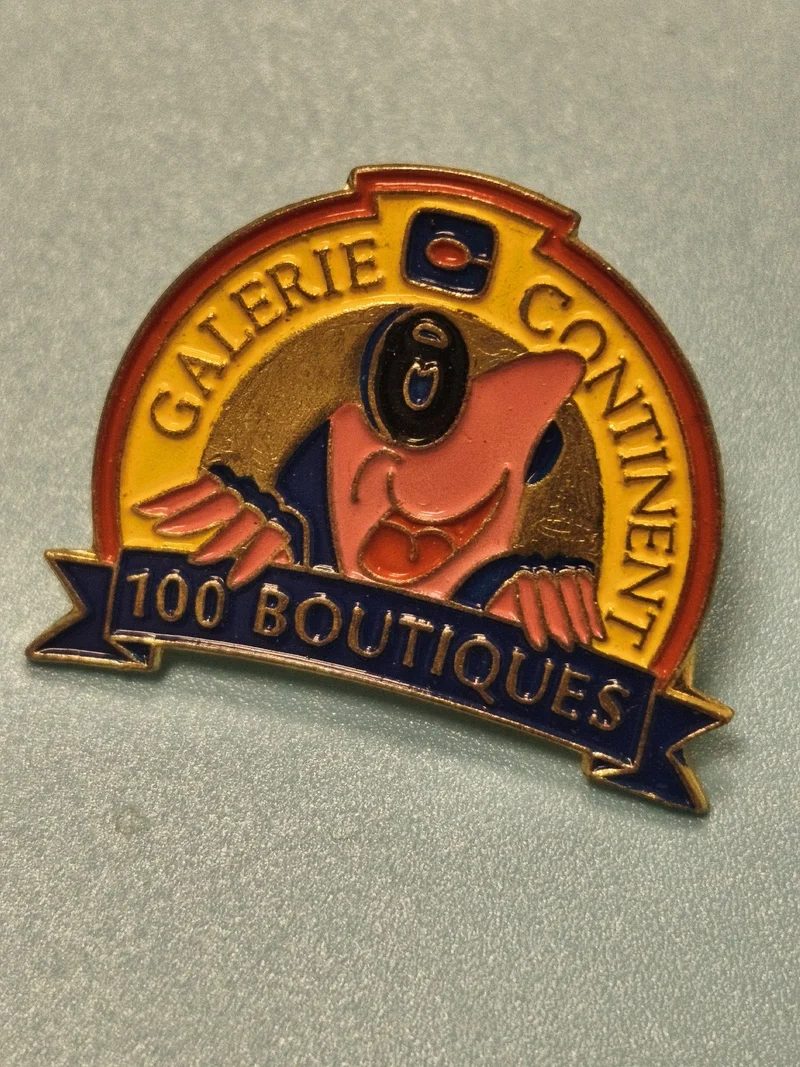 Vintage pin's Galerie Continent 100 Boutiques émaillé personnage rare