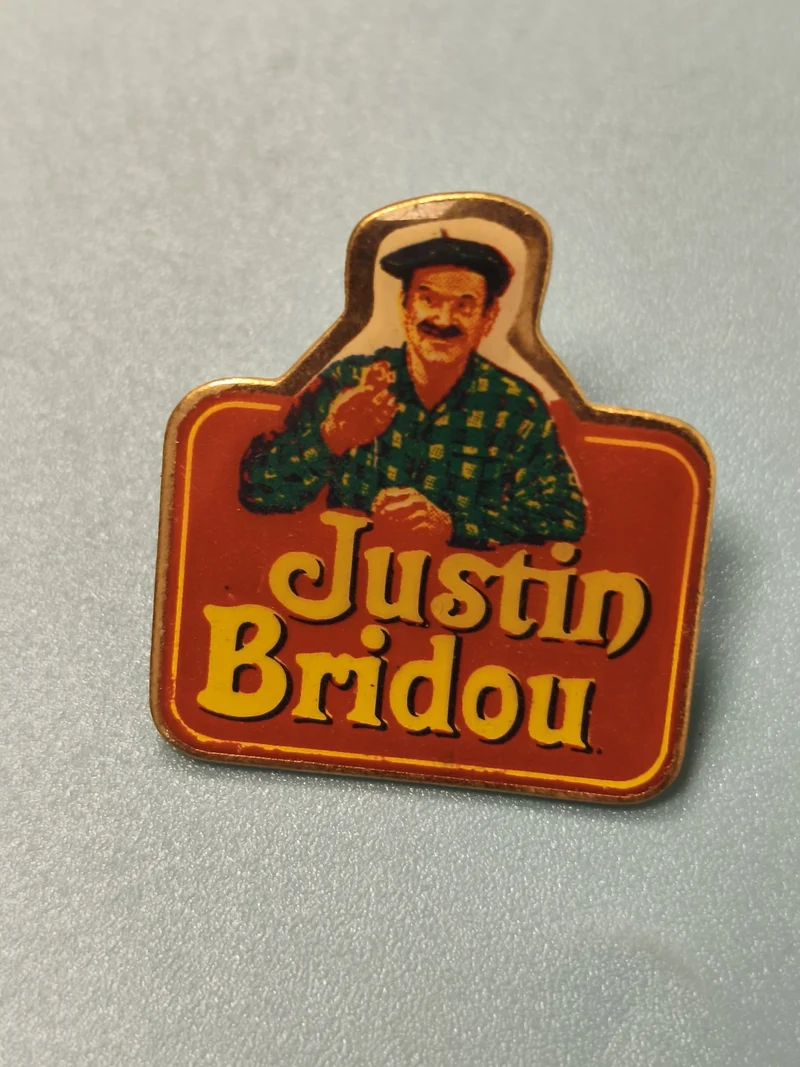 Vintage pin's publicitaire Justin Bridou ancien, logo rouge, collection (Ref 14)