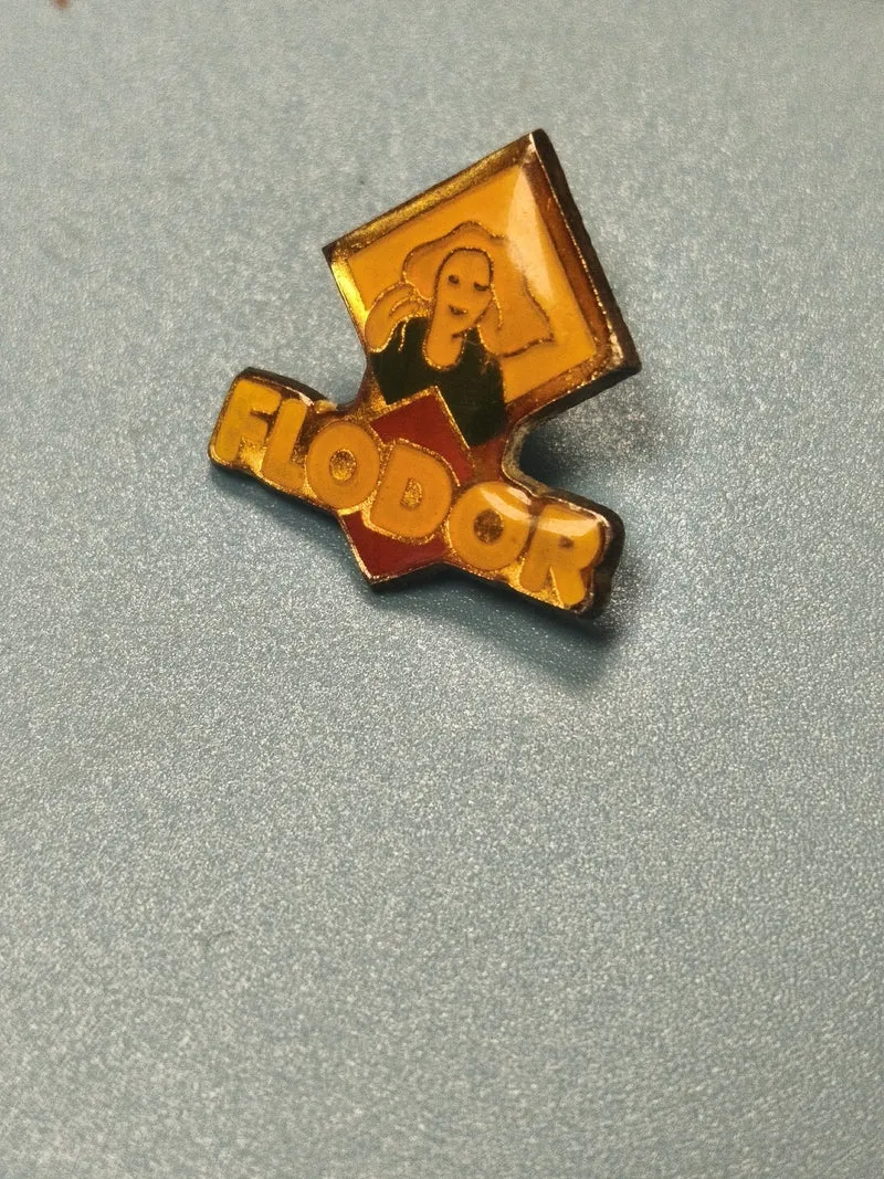 Vintage pin's Flodor publicitaire jaune logo femme collection années 80-90