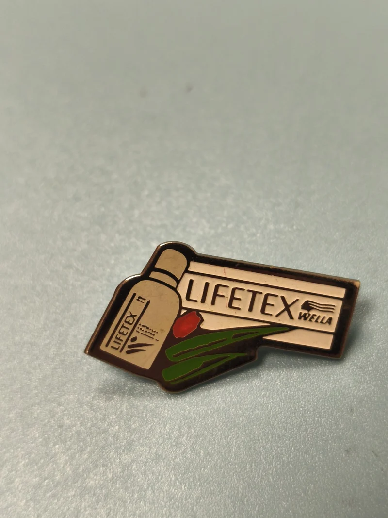 Pin's vintage Lifetex Wella publicitaire, émail, motif bouteille et plante