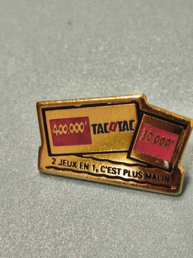Pin's vintage Tacotac ancien jeu de tirage français doré, collection rétro