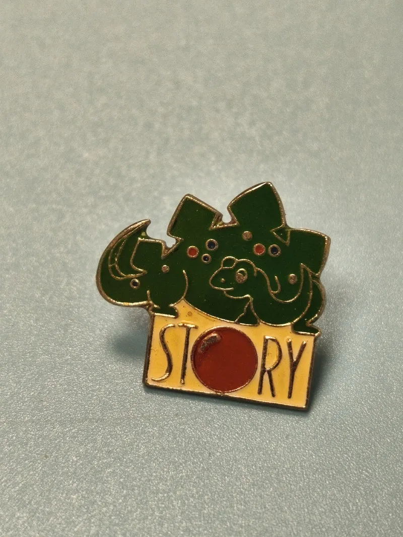 Vintage pin's STORY dinosaure vert émail collection badge original