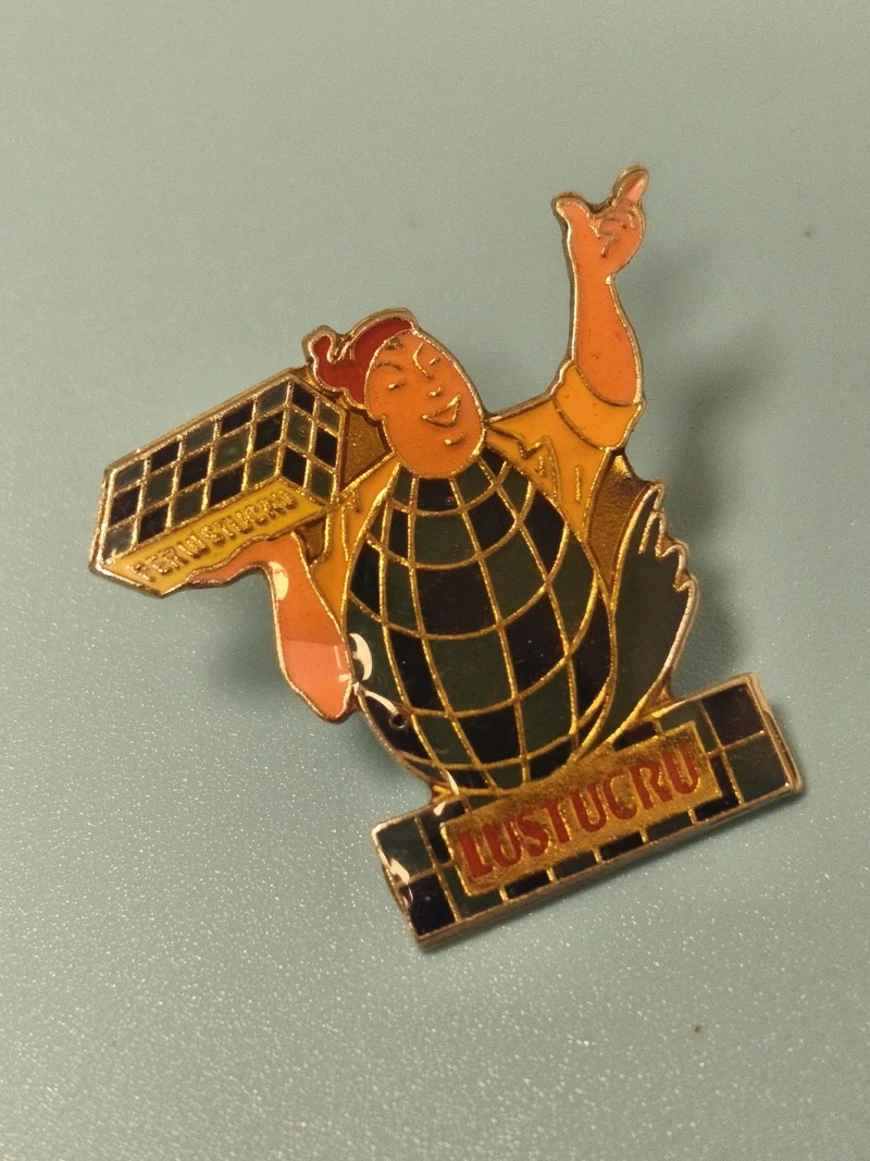Pin's vintage Lustucru, personnage globe, couleurs vives, collection publicitair