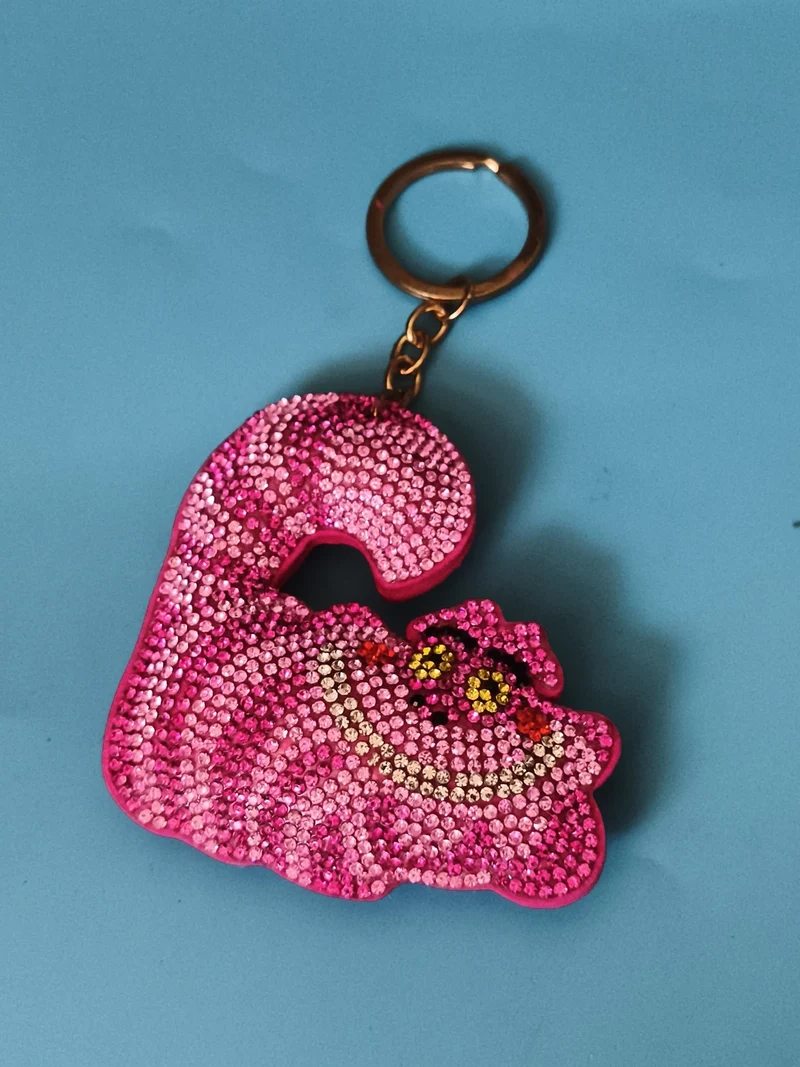 Porte-clés Chat du Cheshire strass rose Alice aux pays des merveilles