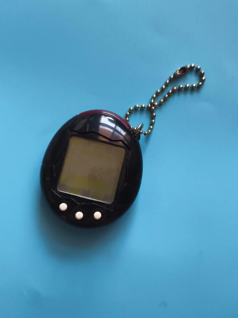Jeu électronique Tamagotchi like noir porte-clés 3 boutons keychain pet game
