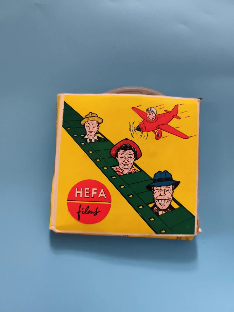 Bobine film ancien HEFA Films boîte jaune illustrée vintage cinéma