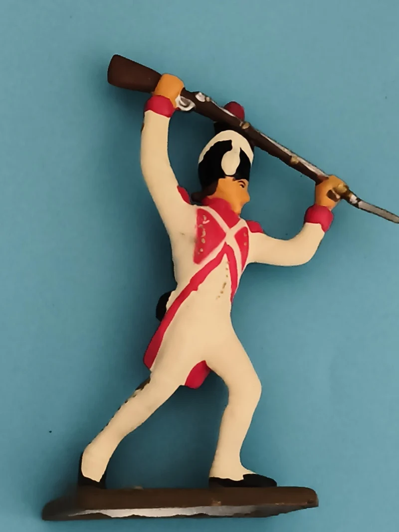 Figurine soldat ancien en plomb uniforme blanc rouge fusil vintage décor