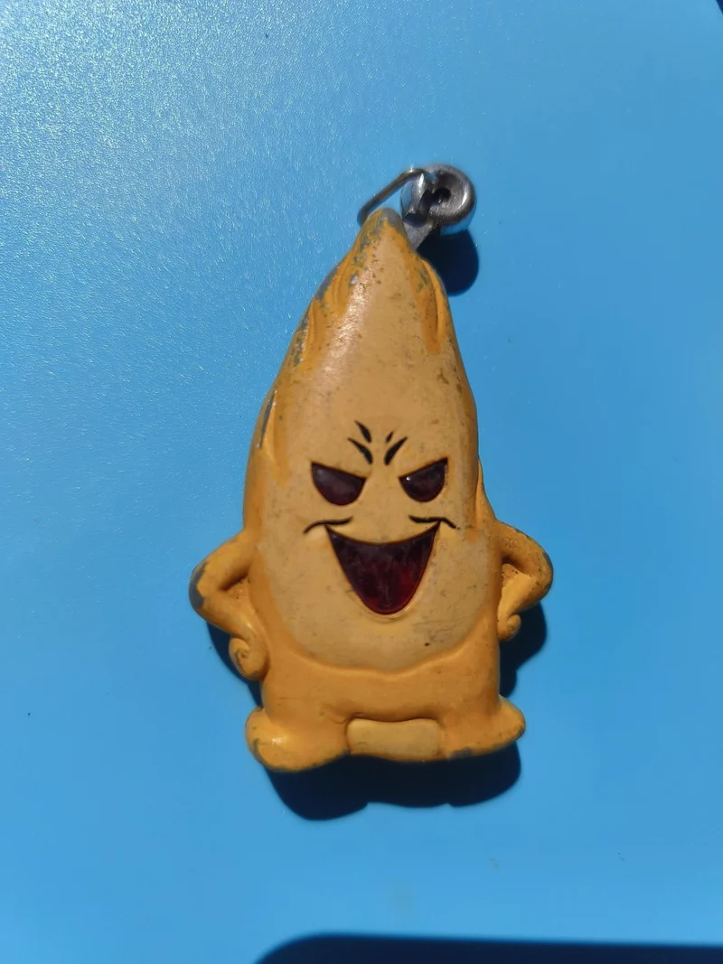 Ancien briquet publicitaire mascotte jaune, fantaisie, à restaurer, rare