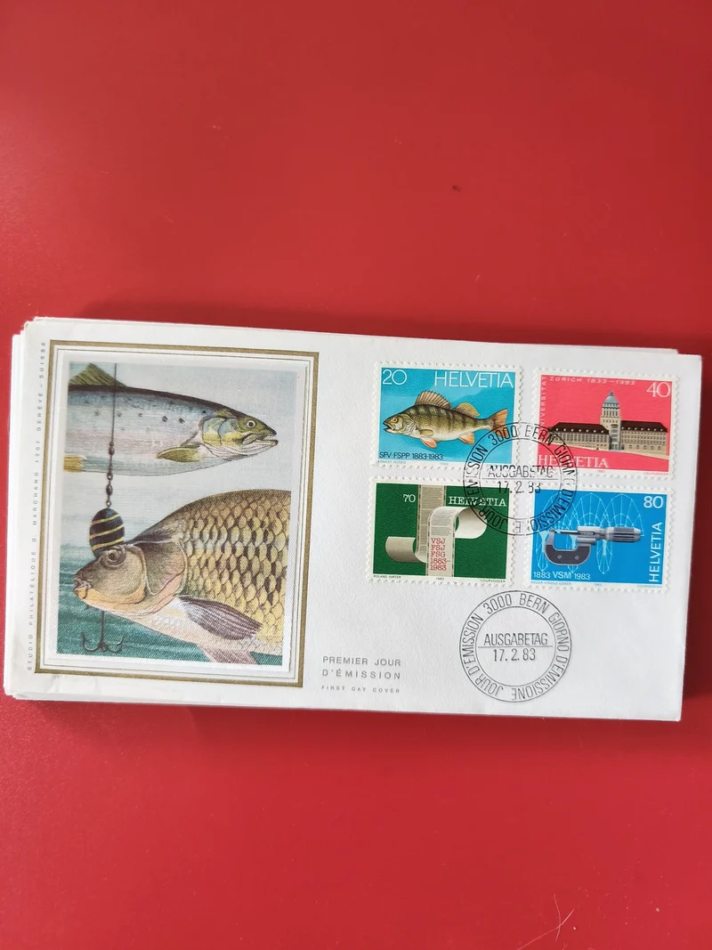 Enveloppe philatélie Premier Jour Suisse timbres Helvetia poissons et motifs