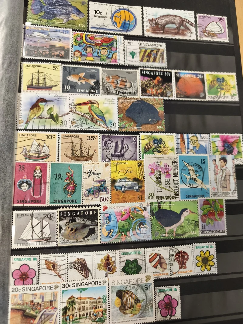 Lot de timbres Singapour multithèmes animaux fleurs véhicules usagés