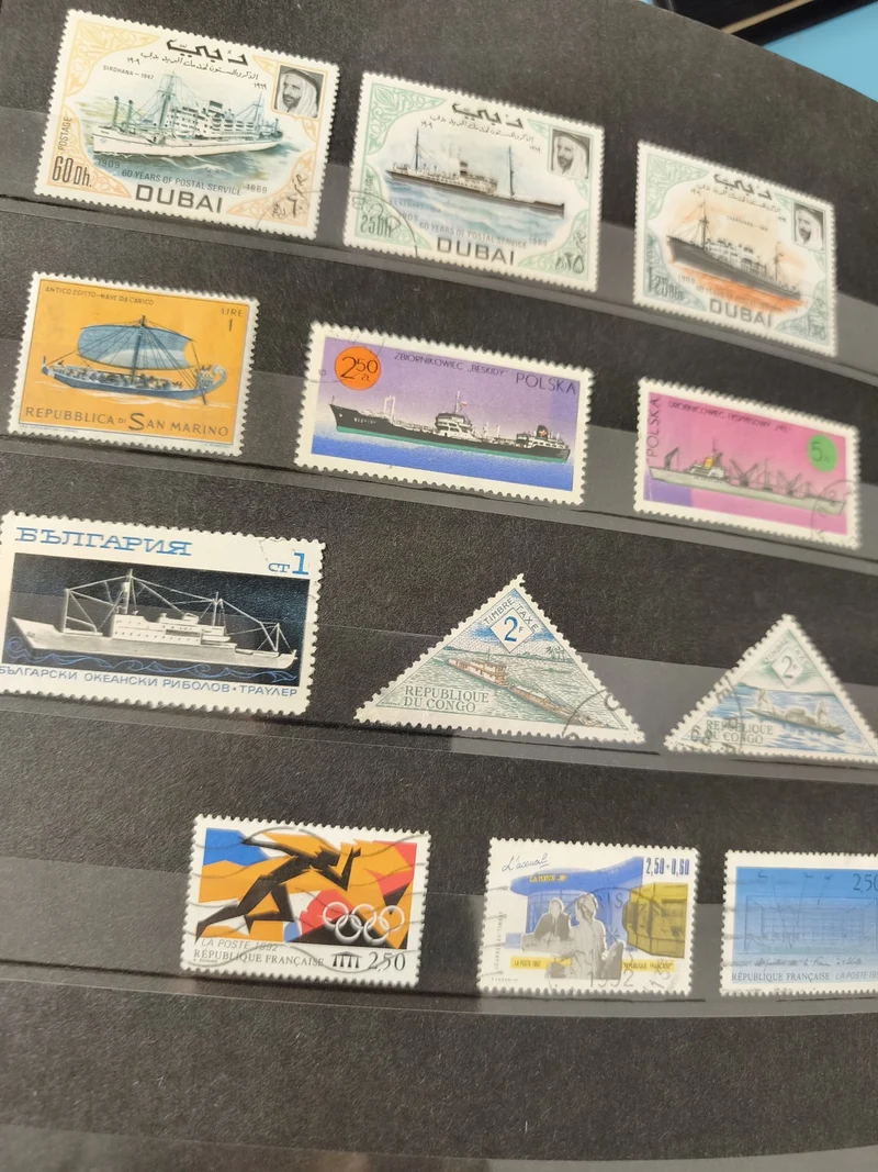 Lot anciens timbres oblitérés Dubai et monde, thématique bateaux et sport