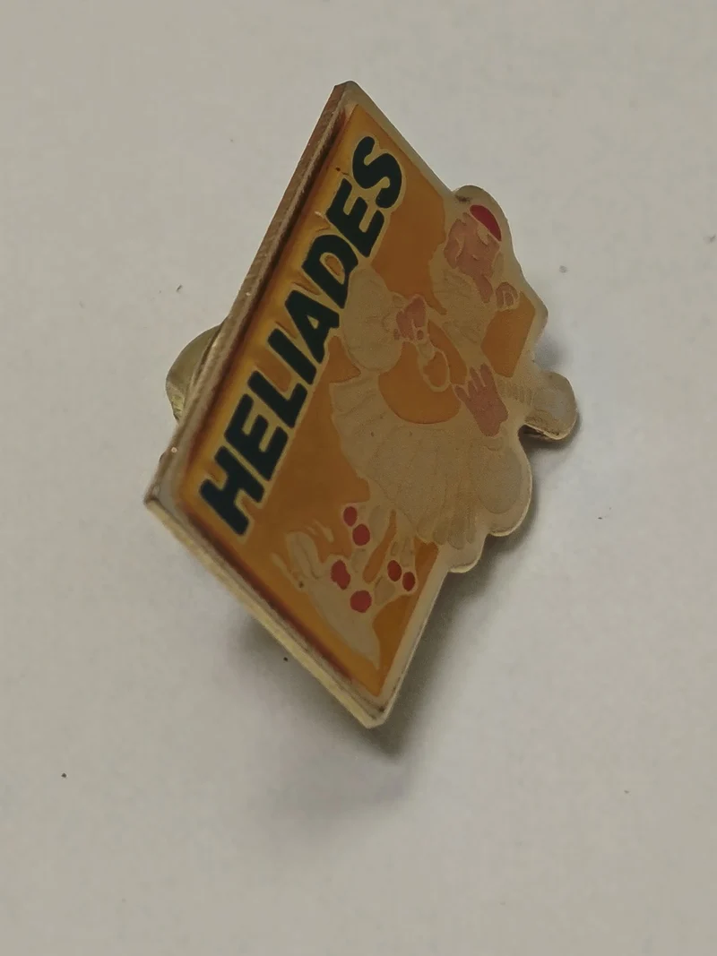 Pin's rétro ancien Héliades ? badge publicitaire vintage collection années 80 90