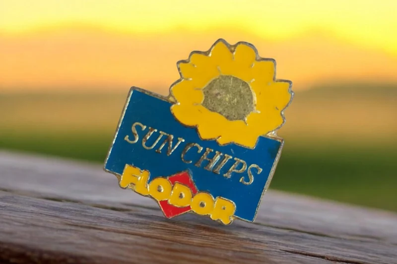 Pin's vintage Flodor Sun Chips tournesol rétro années 90 badge publicitaire