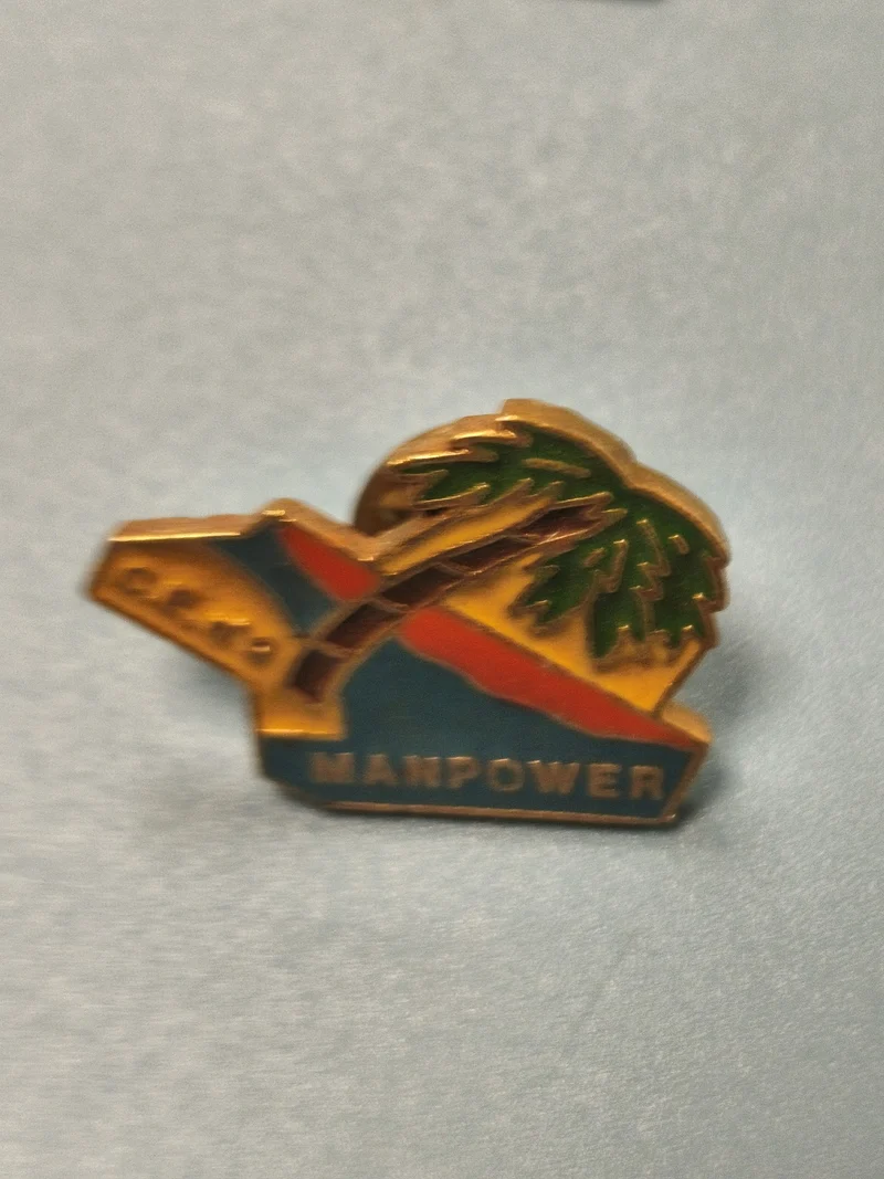 Vintage pin's Manpower émaillé palmier logo coloré ancien collection
